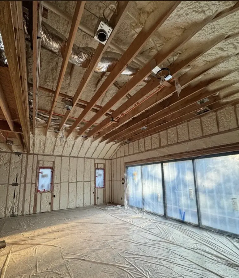 Interior walls and ceiling insulated with spray foam during new construction in Texarkana